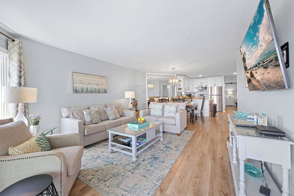 The layout flows easily from the living room to the dining area and updated kitchen, making it simple to relax, dine, and stay connected throughout your time on the island.