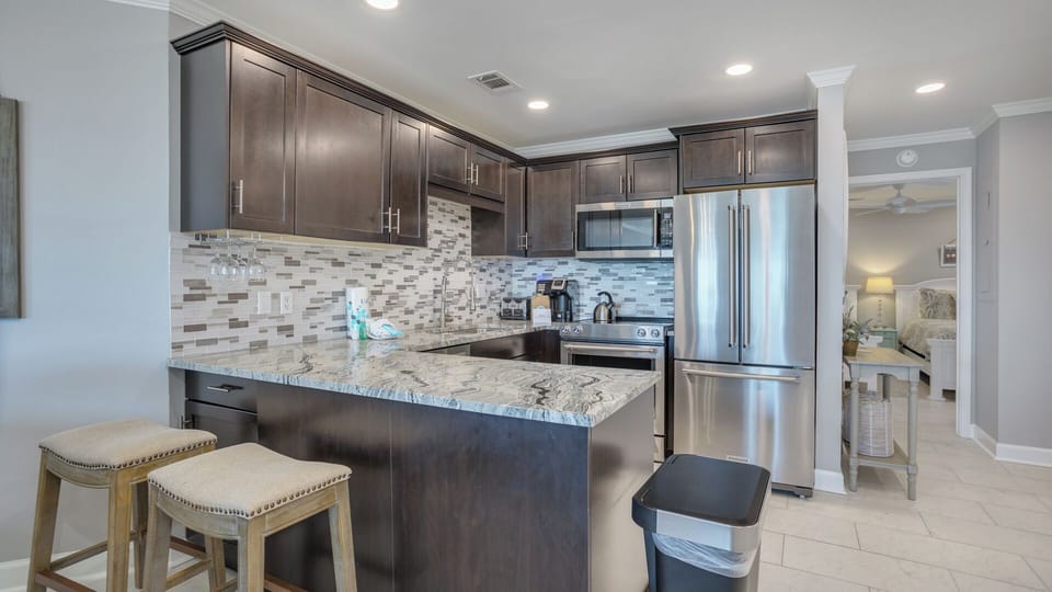 This cute, cozy kitchen is perfect for cooking, featuring brand-new stainless appliances, plenty of storage, and a fully equipped layout that makes meal prep effortless.