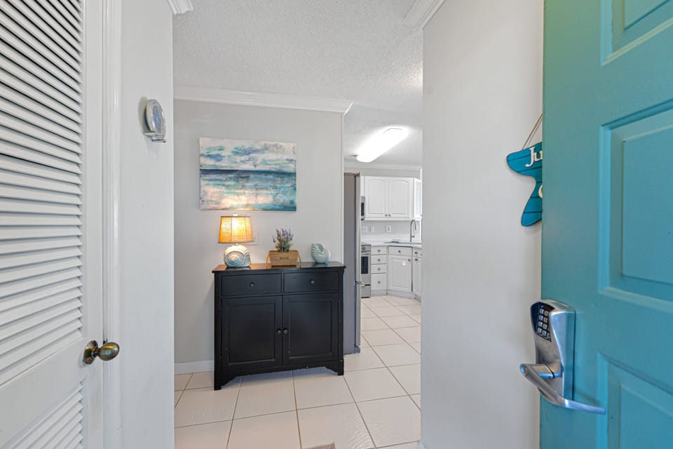A welcoming entry sets the tone right away, with clean coastal touches and a bright, open feel that carries throughout the home.