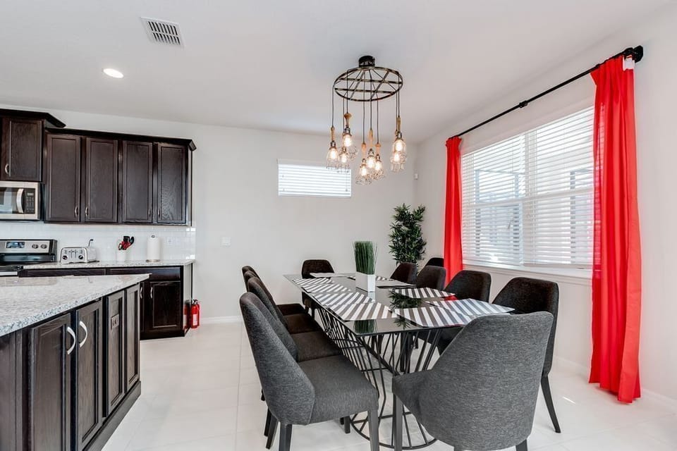 View 2 of gorgeous dining room table seating 10
