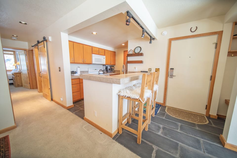 Entryway and full kitchen