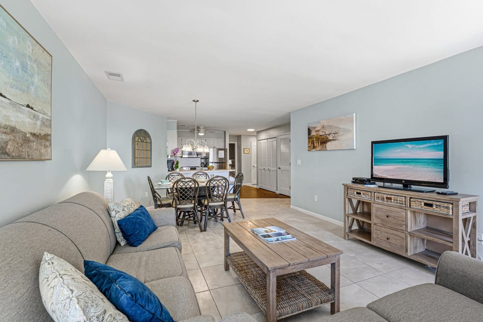 Open and inviting living area with comfortable seating and easy flow into the dining space and kitchen.