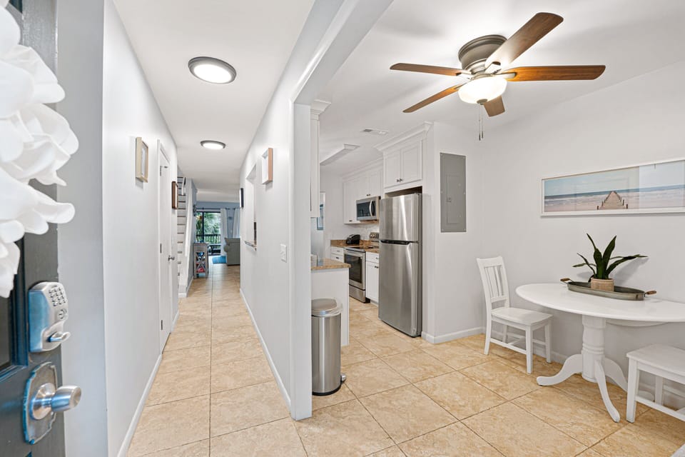 This welcoming entry hallway opens into a bright, open-concept layout with easy flow from the kitchen to the main living area.