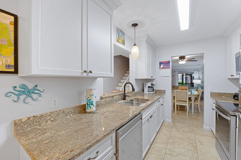 The layout flows seamlessly toward the dining and living areas, making meal prep and entertaining effortless.