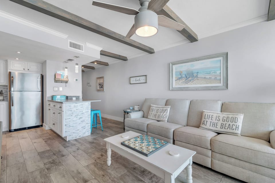 Open Plan Living Area. Comfortable Sofa with two Built-In Recliners with Sweeping Floor to Ceiling Views of the Gulf of Mexico. Large Flat Screen TV w/Built-In DVD Player and Stereo