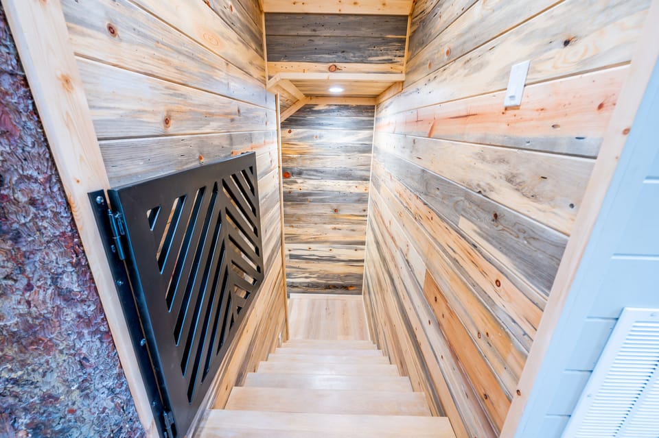 Downstairs to the bottom floor where the game room and 3 bedrooms are housed.