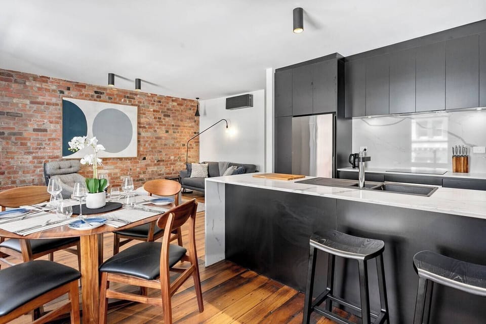 Prepare meals in the monochrome kitchen, fully equipped for cooking and baking your favourite recipes. 