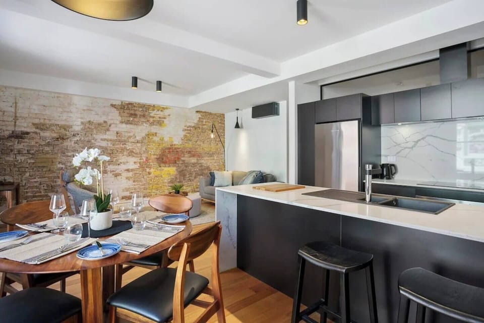 When you’re not dining out, you’ll find all you need in the modern, stylish kitchen to prepare meals at home, with seating at the breakfast bar.  
