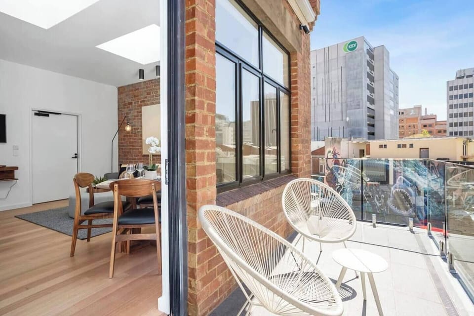 Step out onto your private balcony, where you can enjoy the fresh air and views of the vibrant neighbourhood. It's an ideal spot for a moment of reflection or a lively chat over a drink.