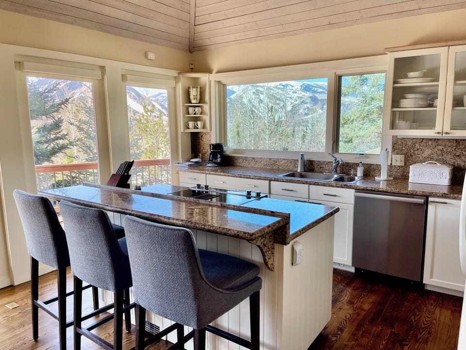 Well stocked Kitchen with Mountain Views while you cook.