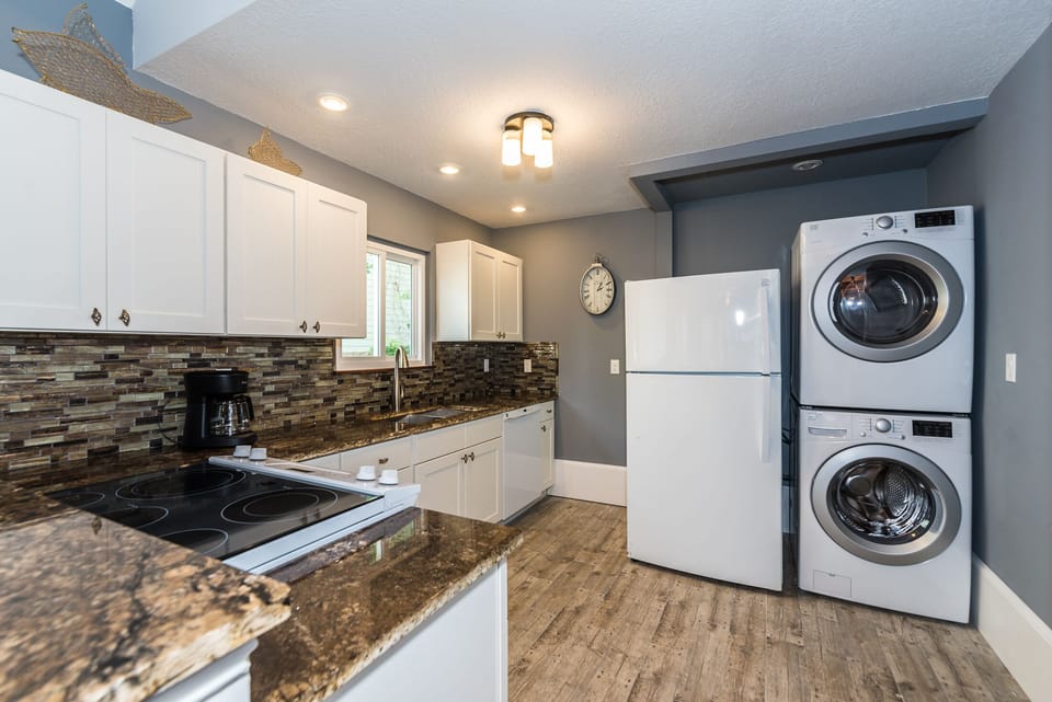 Kitchen with washer and dryer