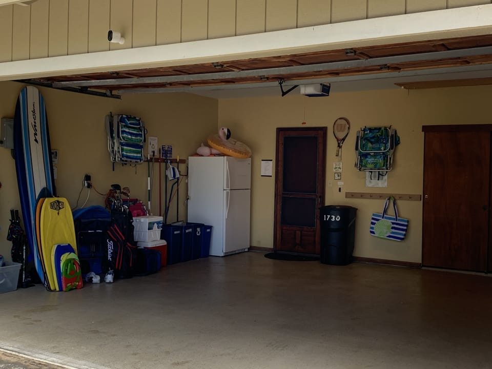 The garage has lots of space for your vehicle and an extra refrigerator.