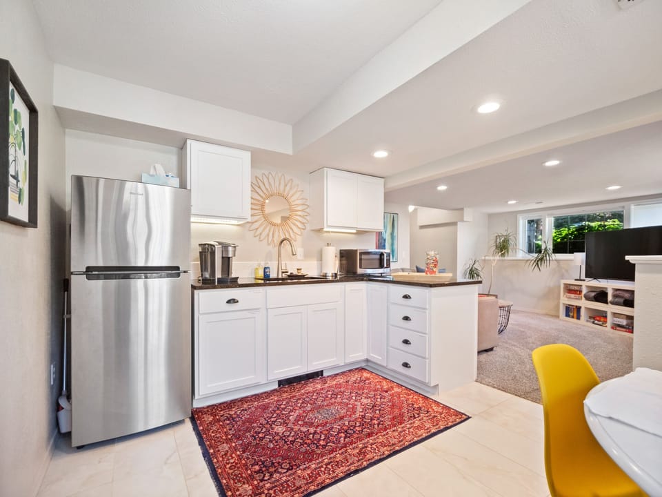 Kitchen has a fridge, Keurig, toaster over, induction burner and microwave.