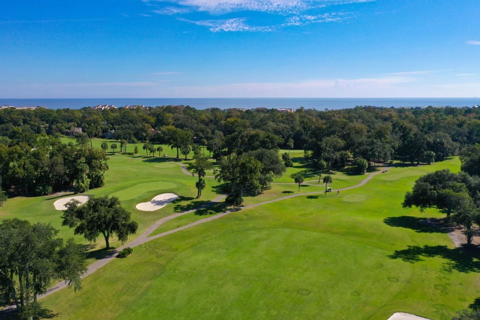 Beautifully maintained Palmetto Dunes golf course, featuring rolling fairways, pristine greens, and classic Lowcountry landscaping.