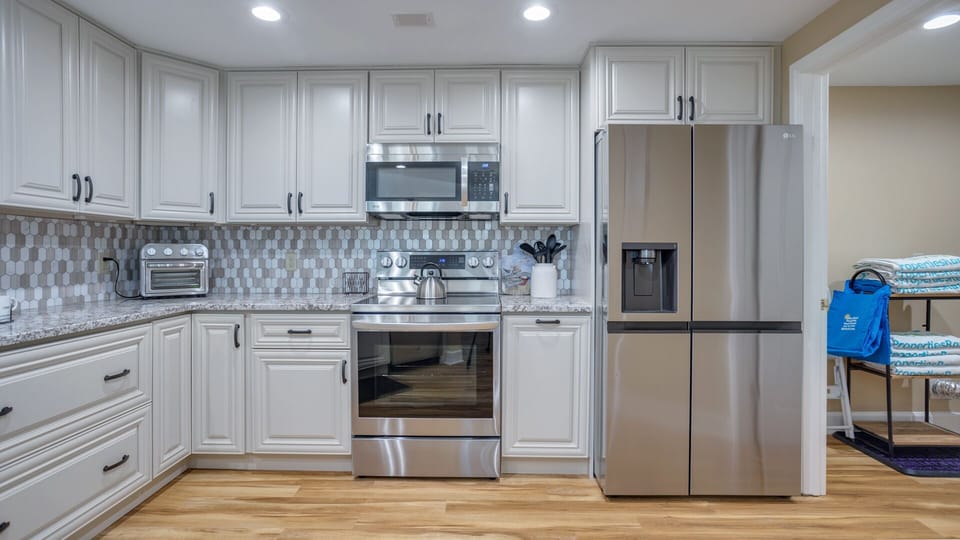 Stainless steel appliances add a polished touch, while the open layout keeps the kitchen connected to the rest of the living space