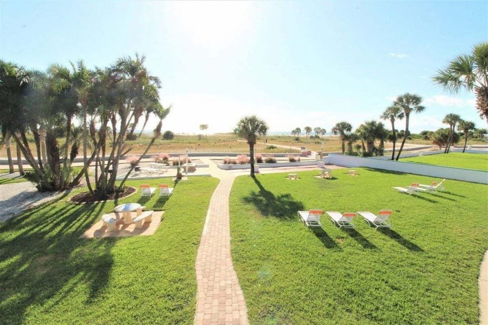 Located at the iconic Tropic Terrace Beach Resort, facing the heated pool - step out of your door and dive into ultimate beach life in seconds!
