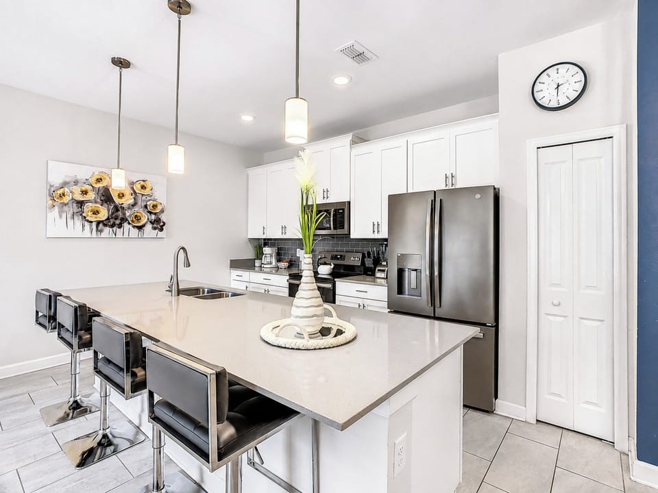 Modern Kitchen with Island Seating and Stainless Steel Appliances