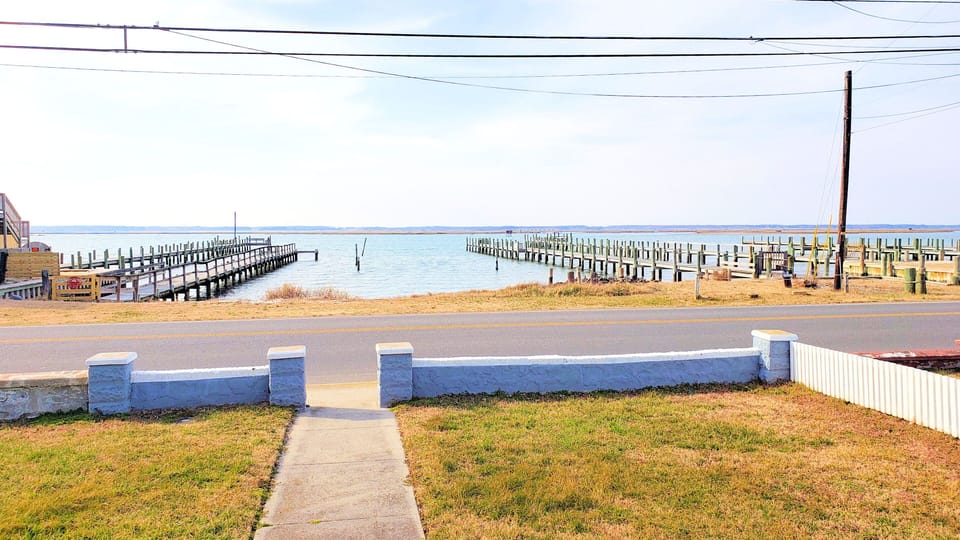 This property does not have a pier, piers shown belong to neighboring properties. You can fish and crab off the shoreline shown.