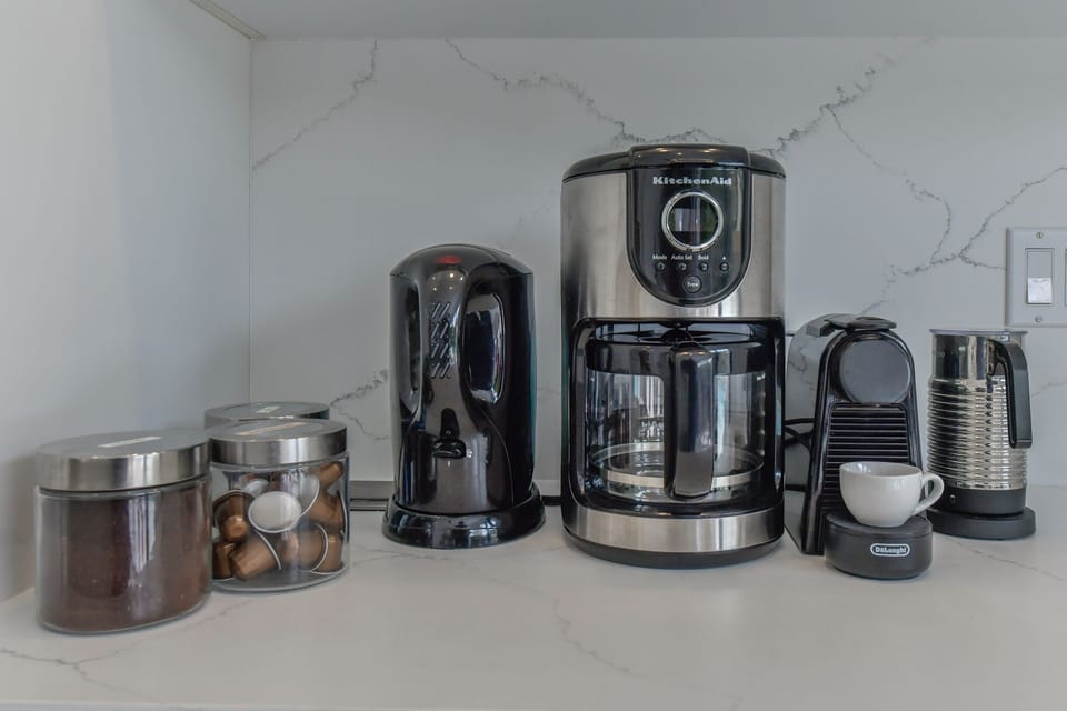 Nespresso machine, drop coffee, milk frother, kettle and starter kit of supplies