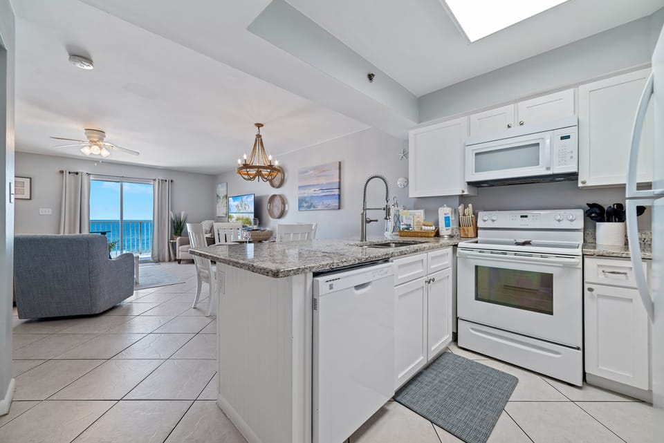 Updated kitchen with stainless steel appliances and quartz countertops, offering both functionality and aesthetic appeal.