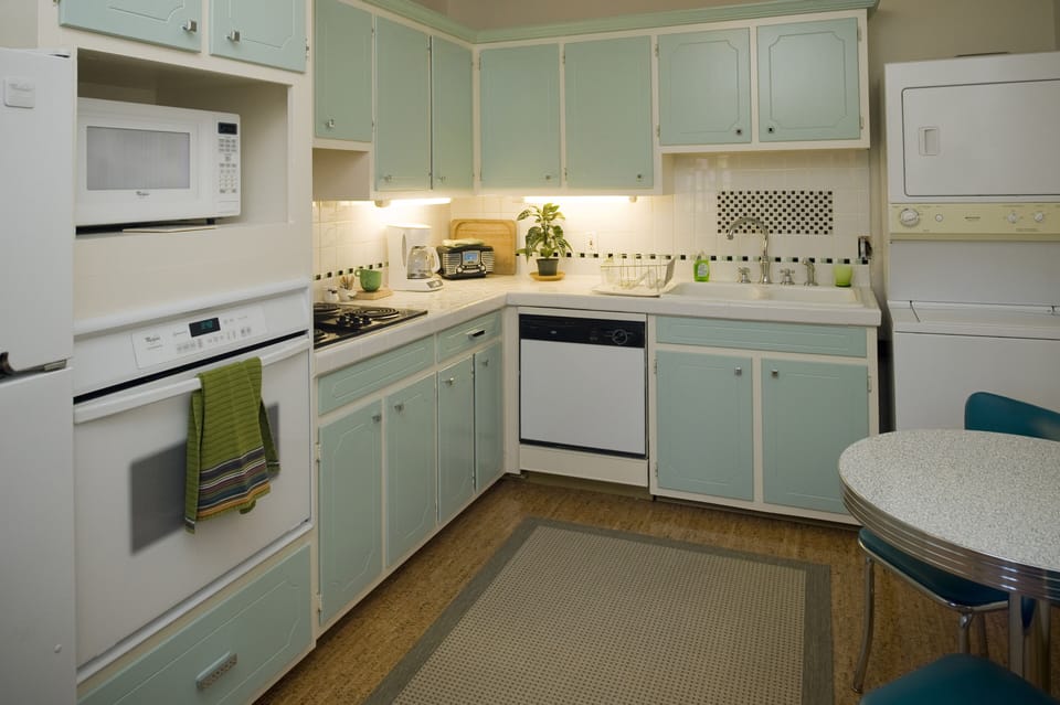 Kitchen with small two-chair table.