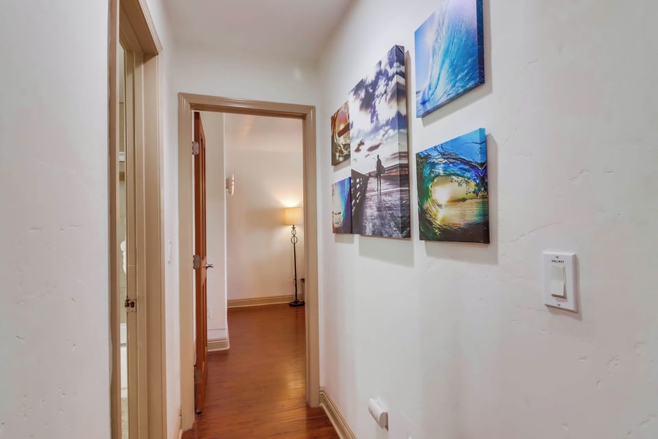Hallway leading to 1st bedroom.