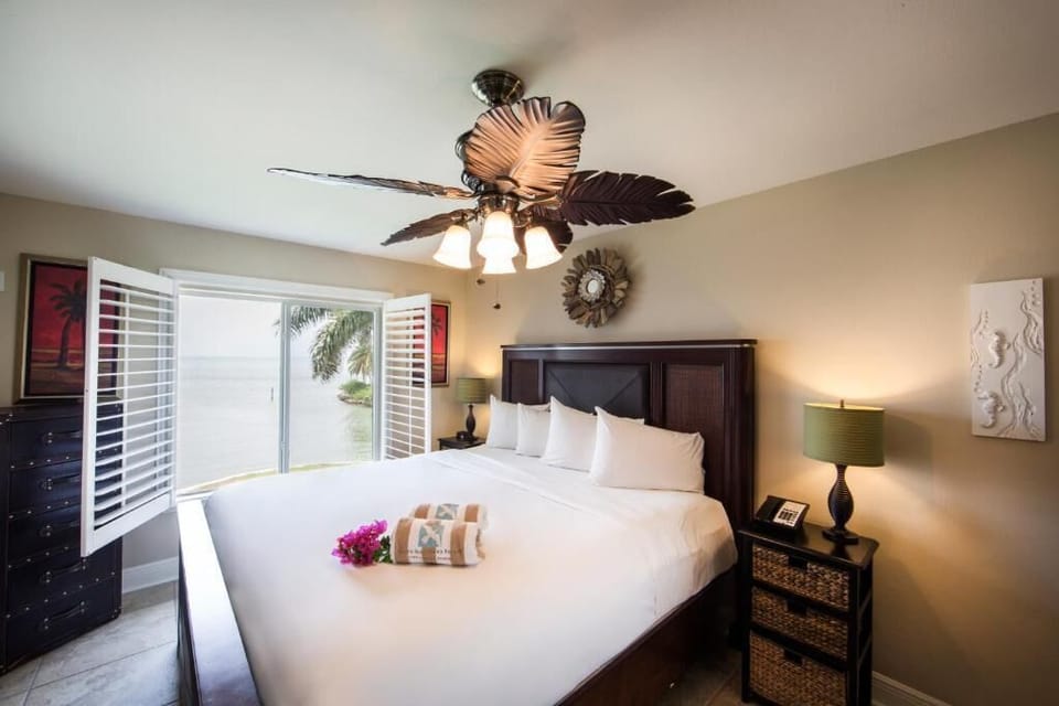 Wake to dreamy water views from your serene king retreat.