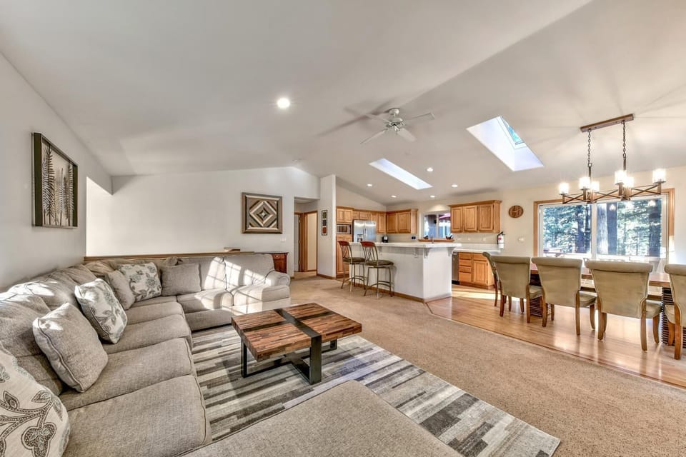 The gorgeous great room's open floor plan allows for ease and comfort while moving from couch to kitchen