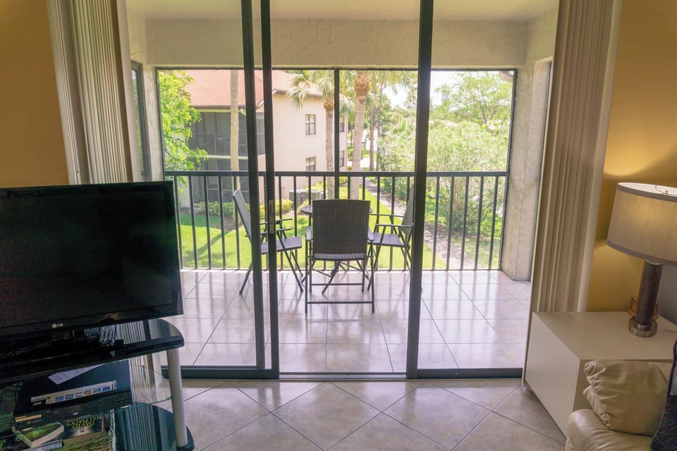 Unwind indoors while sunlight pours in from the balcony