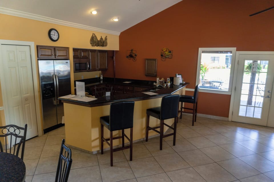 Gather at the sleek counter for snacks and easy conversation.