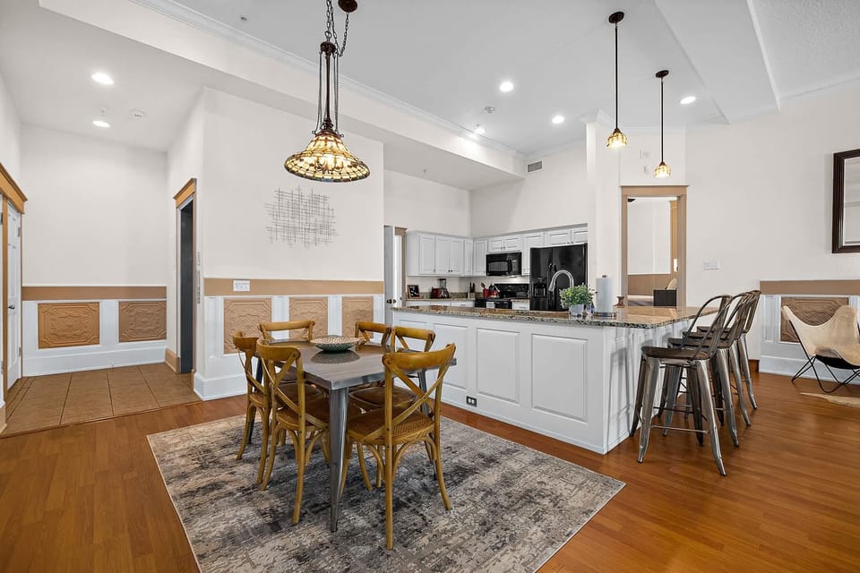 Full dining area with table and bar seating. Room for the entire group!