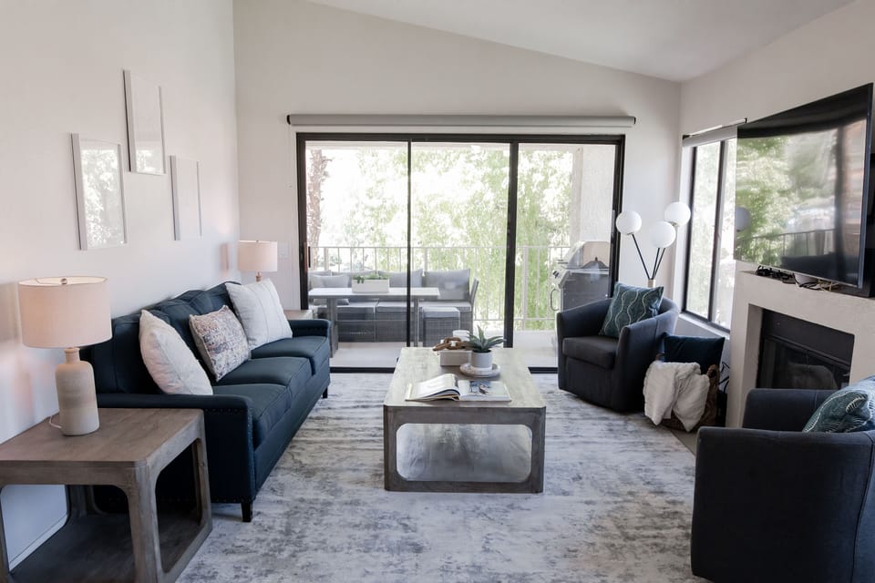 Open Living room with Gorgeous Mountain, Swimming Pool, and Lake Views! 