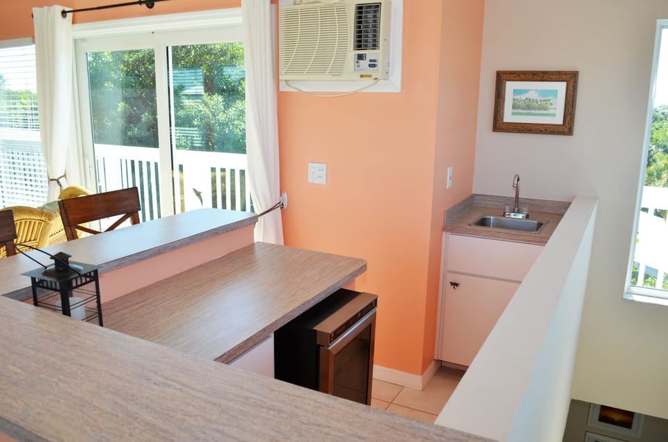 Upstairs loft bar with surrounding roof deck