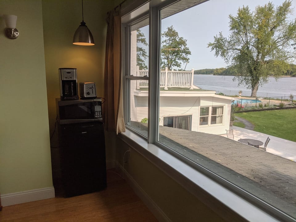 Mini fridge, coffee maker, toaster and microwave with a view