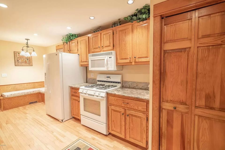 Kitchen with gas stove and granite counters