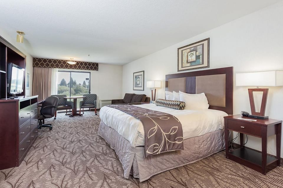Unwind in a spacious king room with cozy seating nook.