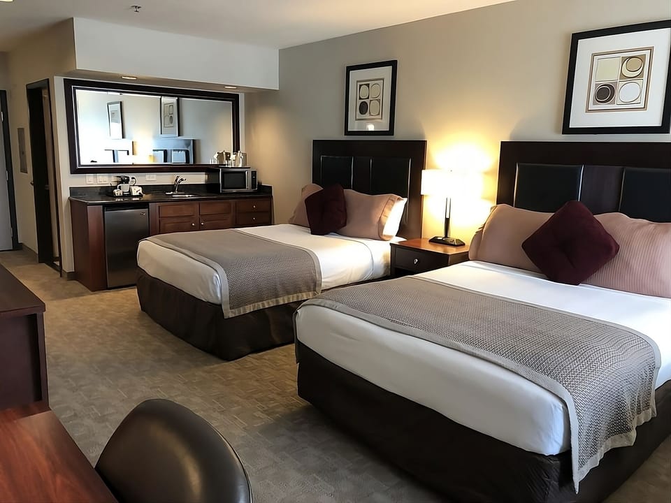 No kitchen, but don’t worry, there’s a mini fridge + microwave in each unit!