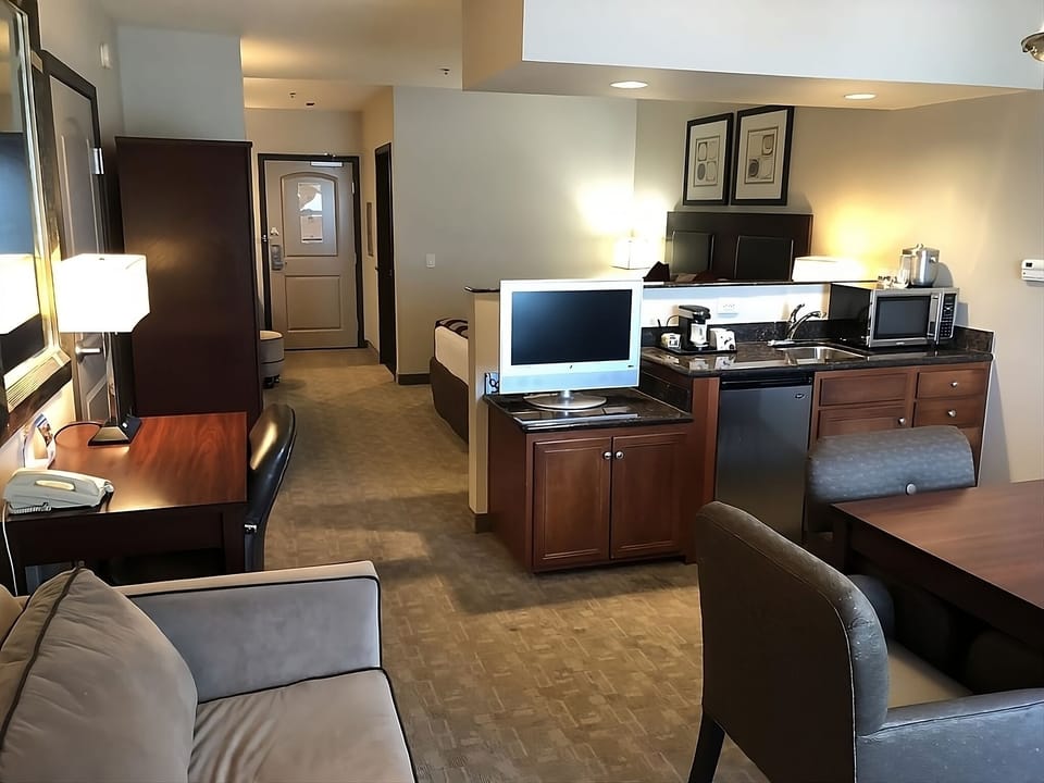 This spacious suite features sleeper sofa, TV, mini fridge, and a microwave