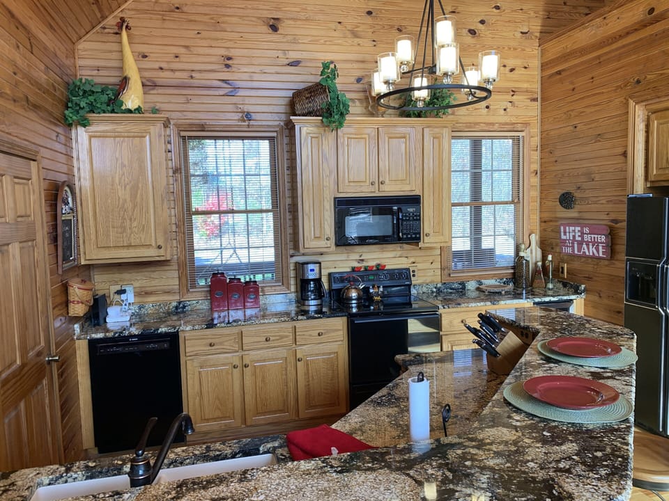 There are two dishwashers in the kitchen, and a second refrigerator downstairs. 