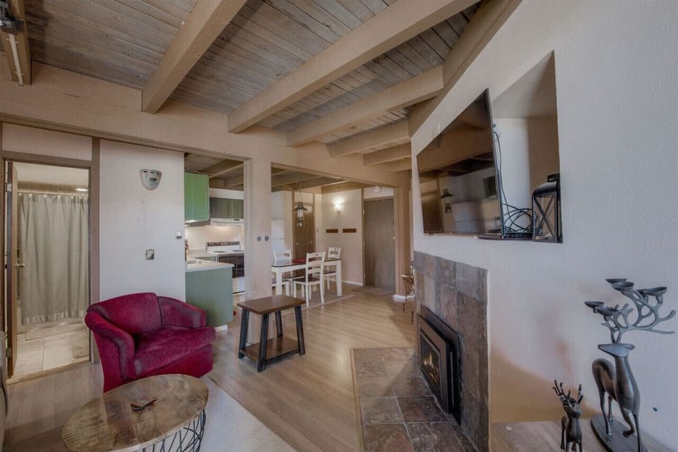 Enjoy relaxing after a day on the mountain in the living room next to the crackling fire with your favorite movie playing