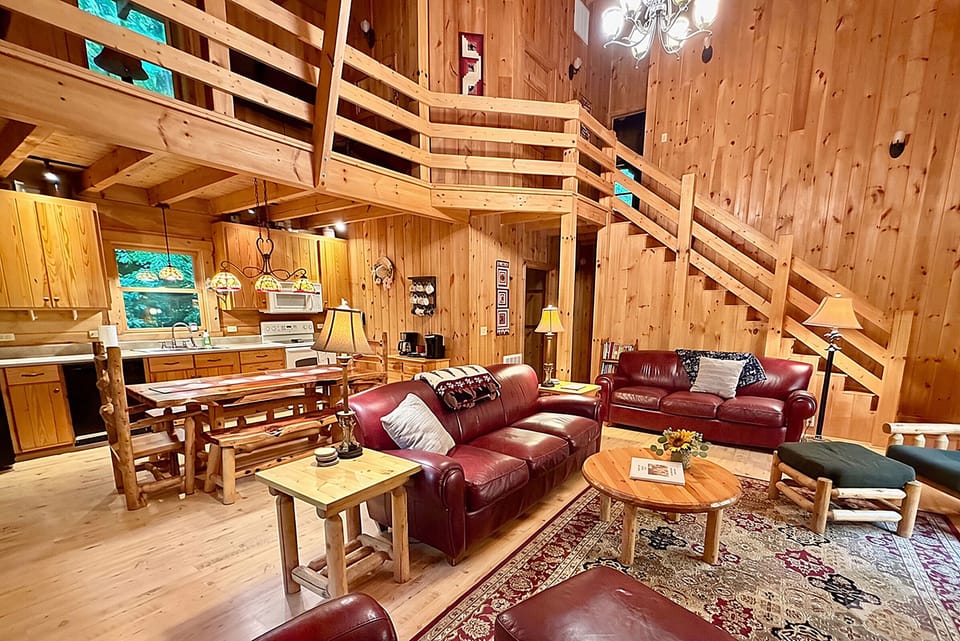 Your open concept Great Room w/ soaring 22 foot high cathedral beamed ceiling.