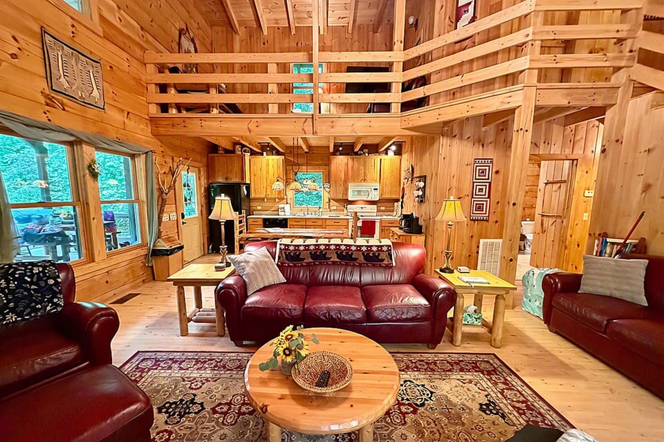 Your open concept Great Room w/ soaring 22 foot high cathedral beamed ceiling.