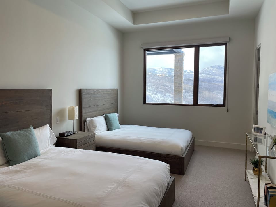 Lower level 2-Queeen bedroom (bdr 2) with beautiful picture window and view.