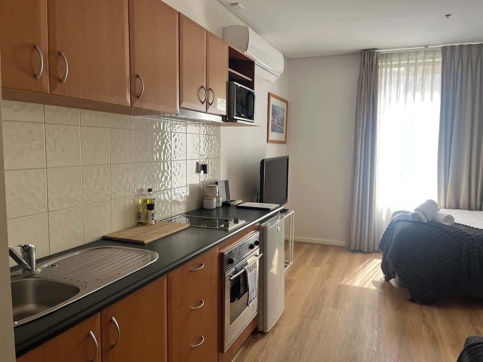 Our convenient kitchenette offers a stove and sink, providing essential facilities for preparing light meals during your stay