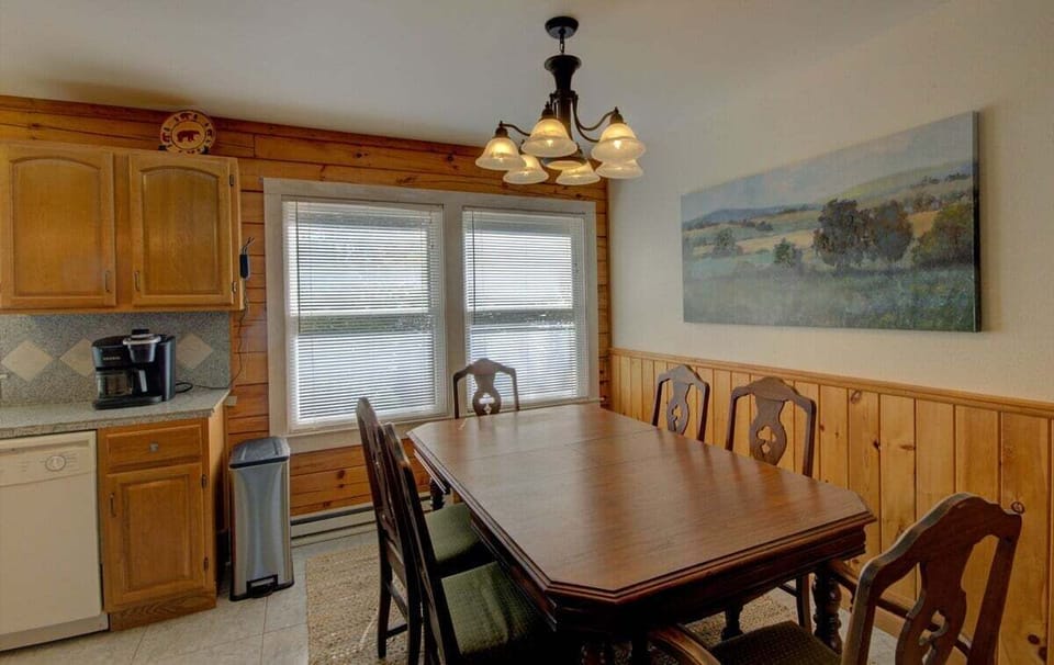 Seat six in the dining area adjoining the kitchen.