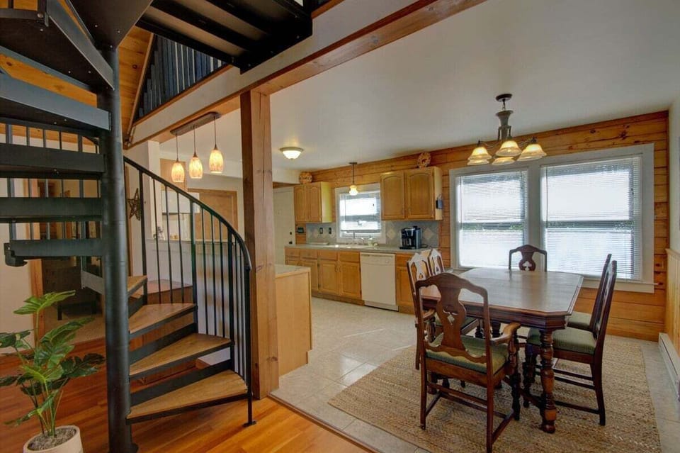 The spiral staircase leads up to the loft.
