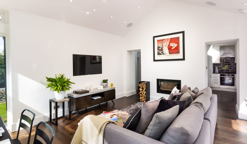 Stylish and Relaxing Open Plan Living Area with built Log Burner.