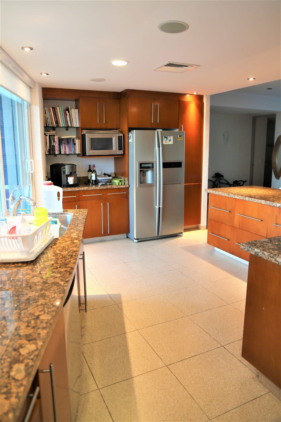 Large kitchen fully equiped with washer, wine conserver, fridge with icemaker...