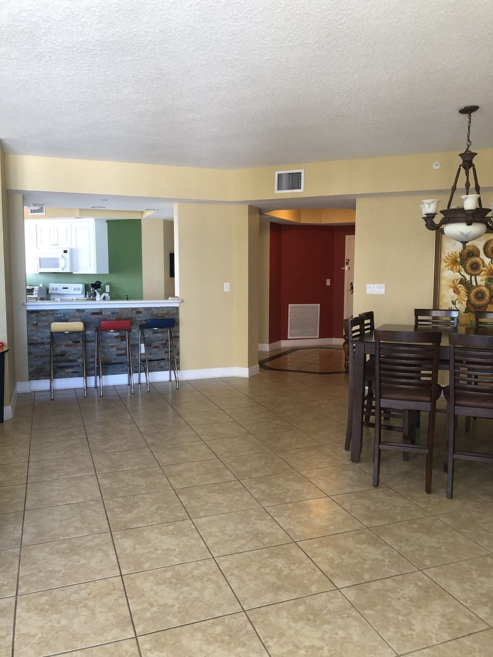 Family room, stools at bar, dining area