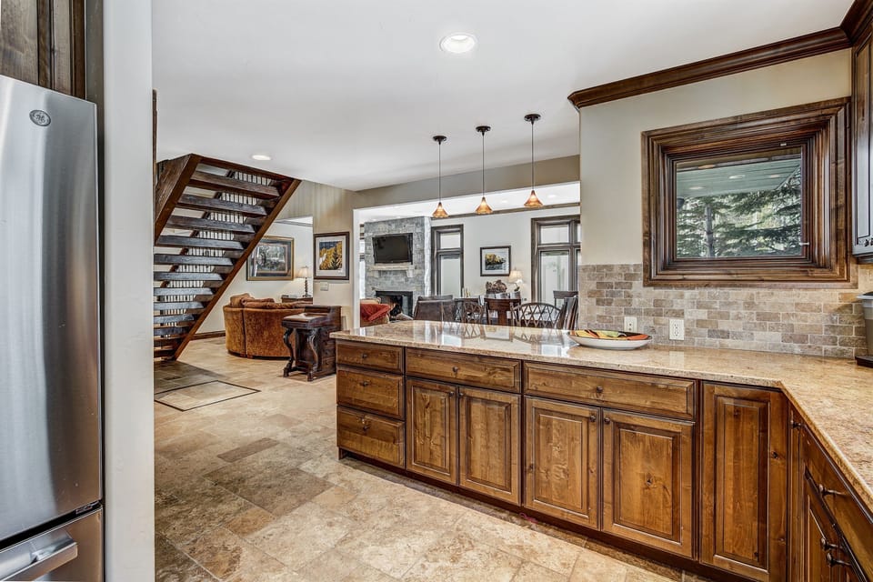 Kitchen with open floor plan to dining and living areas.